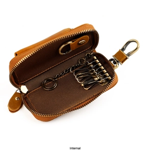 Internal view of brown leather key case with six vintage metal hooks and ring
