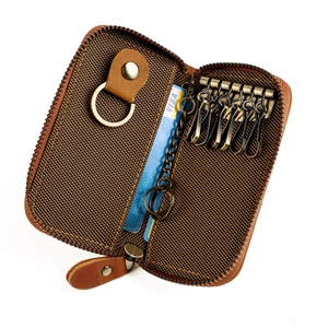 Brown woven leather key case with six hooks, card slot and detachable key ring