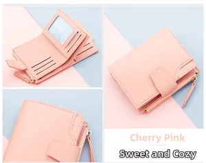 Pink trifold wallet detail showing card slots, ID window, and zipper coin pocket
