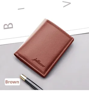Detailed view of a brown pebbled leather wallet with embossed logo and neat stitching