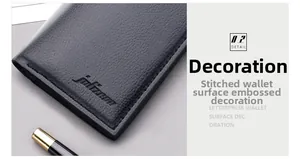 Macro shot of vertical black lychee leather wallet with precise stitching and embossed logo