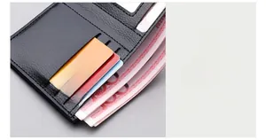 Detailed close-up of internal slots and fine stitching of a black leather men's wallet