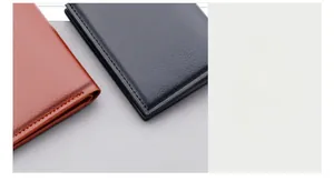 Close-up of vertical men's leather wallet showing precise stitching and litchi texture