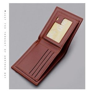 Detail view of brown pebbled leather wallet interior with three card slots and ID window