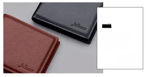Close-up of litchi texture leather wallets with precision stitching and embossed logo
