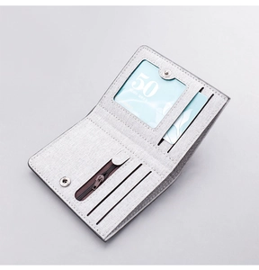 Inside view of slim canvas wallet featuring card slots, ID window and zipper pouch