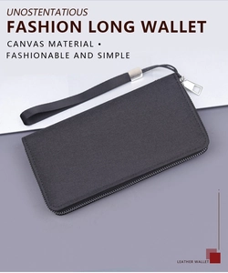 Detail of black canvas wristlet wallet with metal zipper and durable strap