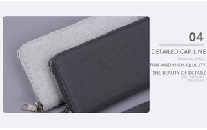 Detail of grey canvas hand clutch showing the high-quality stitching and metal zipper
