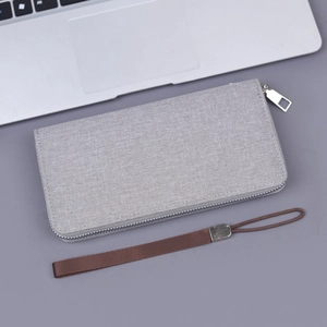 Light gray canvas zip clutch for men with textured fabric finish and wrist strap