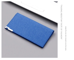 Detailed view of long blue canvas wallet texture with silver metal hardware accent