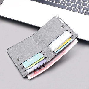 Slim grey canvas bi-fold wallet for men with multi-card slots and a clear ID window