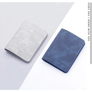 Detail view of ultra-thin matte leather card wallets in gray and blue with fine stitching