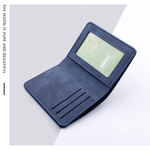 Detail view of dark blue wallet showing three card slots and a clear ID window with stitching
