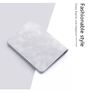 Close-up of slim gray frosted leather wallet with detailed stitching and sleek texture