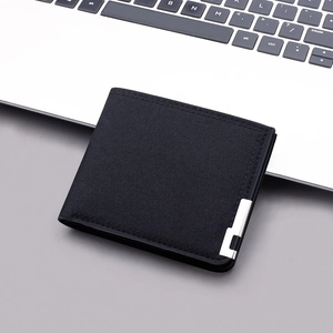 Minimalist black canvas bifold wallet for men with metal detail and sleek design