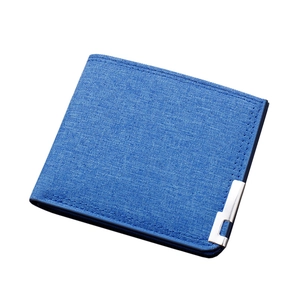 Slim men's bifold canvas wallet in bright blue featuring premium fabric texture and silver clip