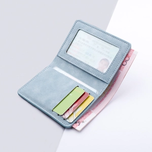 Slim light blue vertical bifold card holder with multi-card slots and an ID window