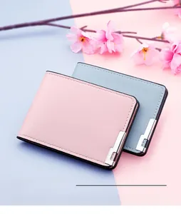 Detail of pink and blue faux leather driver license holders with metal corner accents