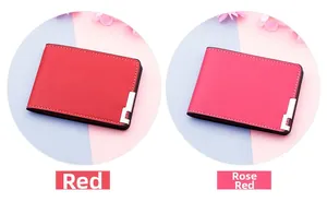 Detail of minimalist leather driver license covers in red and rose red with metal corners