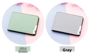 Detail of pea green and gray leather driver license covers with silver metal corners