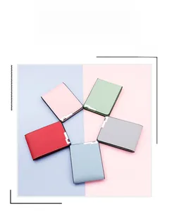 Detailed flat lay of bi-fold driving license covers in multiple pastel colors and textures