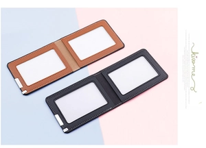 Close-up of leather driving license holder with dual card slots and metal corner protectors