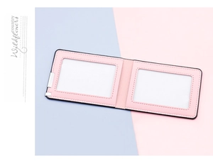 Pink pebbled leather driving license holder featuring dual clear ID windows and metal clip