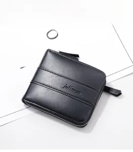 Detailed view of black textured leather wallet with embossed logo and metal zipper closure