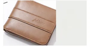 Detail of premium brown pebble leather wallet featuring embossed logo and fine stitching