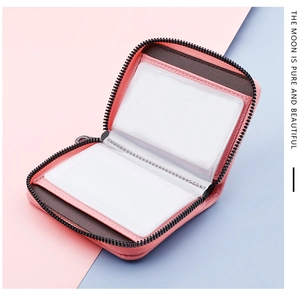 Pink zip-around card holder featuring multi-slot interior for cards and licenses