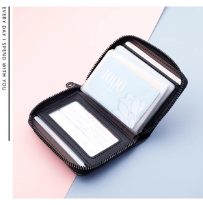 Detailed view of black litchi pattern card holder with expandable accordion slots