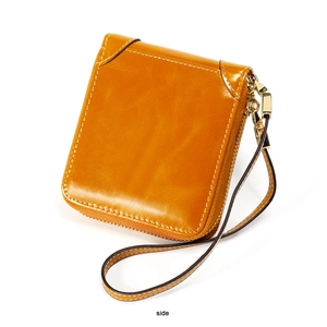 Vue latérale du portefeuille rétro en cuir ciré avec fermeture éclair dorée et coutures