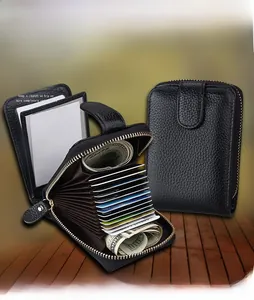 Macro detail of black leather accordion wallet showing card slots and transparent ID window