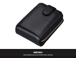 Detail view of black lychee leather card holder with secure zipper and side gussets