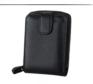 Detailed front view of black litchi grain leather card holder with vintage metal zipper