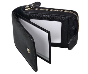 Macro view of black leather wallet interior with card slots and transparent ID window