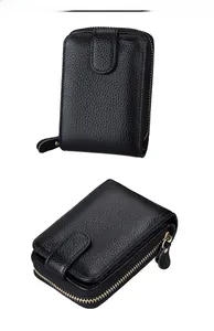 Detail view of black lychee leather card holder with accordian style and metal zipper