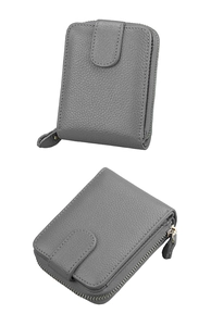 Detailed macro view of grey grain leather wallet with zipper and snap button closure