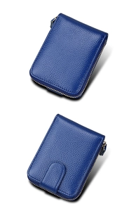 Detail view of sapphire blue pebbled leather wallet with gold zipper and back card slot