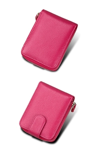 Detailed view of rose red lychee grain leather wallet with zip closure and snap buckle