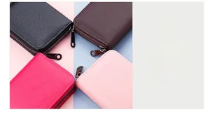 Detailed view of leather card holder wallets with litchi texture and metal zippers
