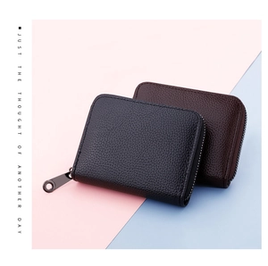 Close-up of premium lychee texture leather card holders with smooth metal zippers