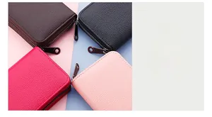 Detail view of the fine stitching on lychee pattern leather card holders with zip closure