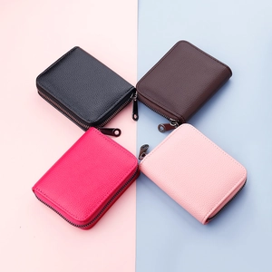 Compact leather card holder with 14 slots and zipper in four vibrant colors
