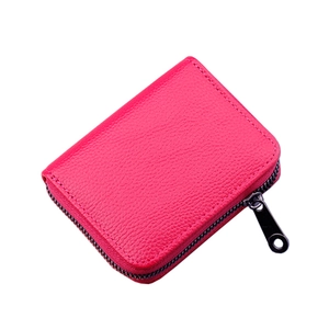 Rose red leather card holder with 14 slots and metal zipper on white background