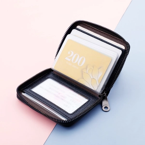 Black leather card holder with 20 slots and zip closure, lychee texture, multi-card capacity