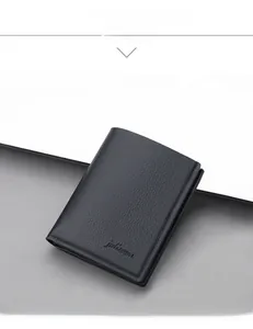 Close-up of black oil wax leather men's wallet showing litchi texture and logo