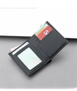Detail of bifold leather wallet interior with ID window, card slots, and money compartment