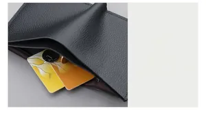 Macro shot of vertical leather wallet showing internal zipper pocket for coins and cards
