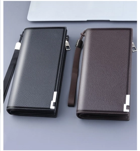 Detail of high-quality lychee pattern leather men's long wallets in black and dark brown